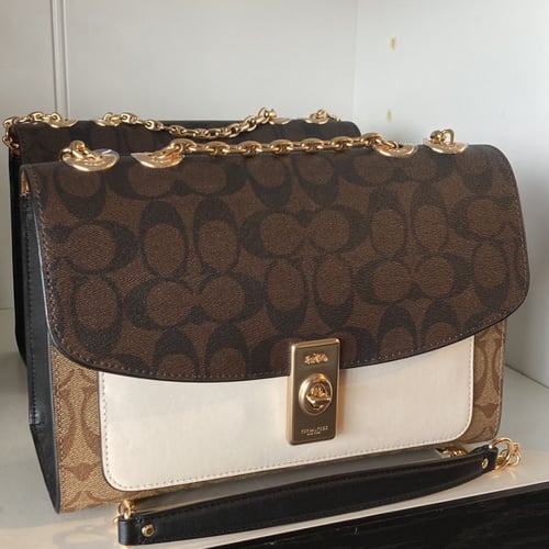 حقيبة كتف "لين Lane" من القماش بنقشة ماركة كوتش