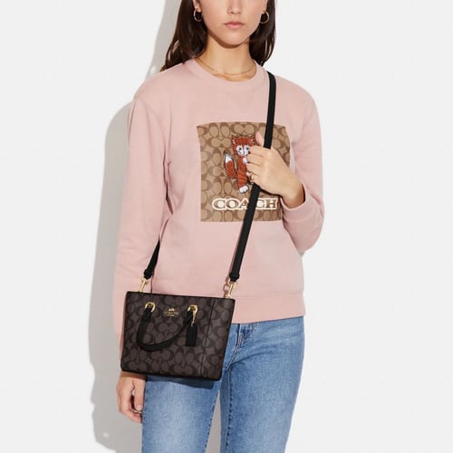 شنطة كوتش كروس بدي بني وفوشي ميني