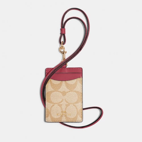 حافظة بطاقة شخصية من القماش الذي يحمل نقشة ماركة ك...