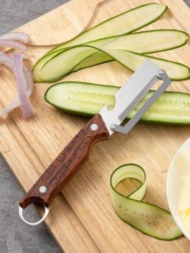 أداة تقشير ( قشارة ) للخضروات والفواكه مصنوعة من ا...