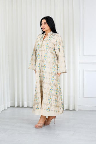 جلابية قماش بطول يصل للكاحل ونهايات أكمام واسعة وي...