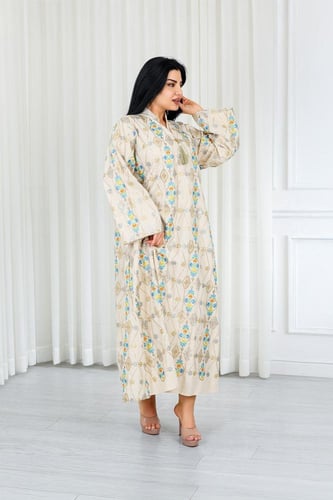 جلابية قماش بطول يصل للكاحل ونهايات أكمام واسعة وي...