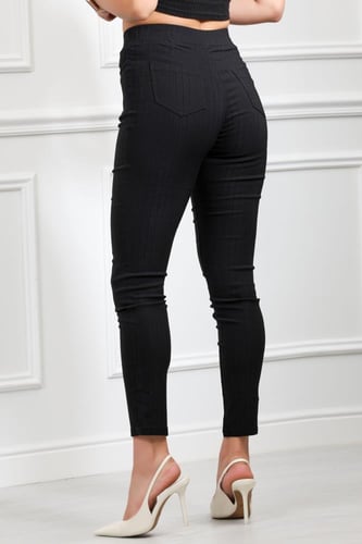 بنطال جينز خصر عالِ مطاطي بقصة ضيقة حتى الكاحل