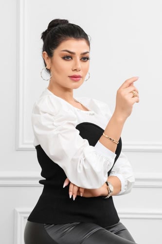 بلوزة نسائية أنيقة بأكمام منتفخة