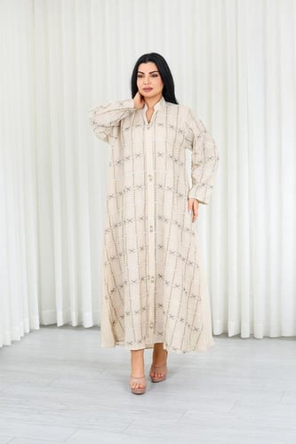 جلابية قماش بطول يصل للكاحل وياقة صغيرة مفتوحة على...