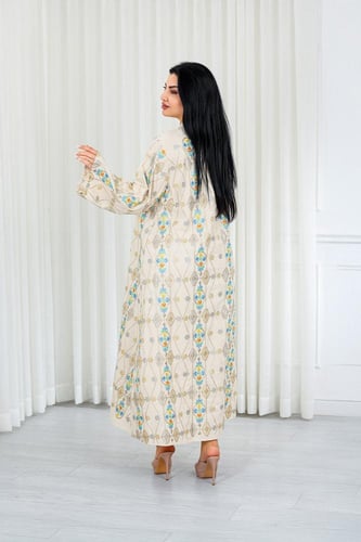 جلابية قماش بطول يصل للكاحل ونهايات أكمام واسعة وي...