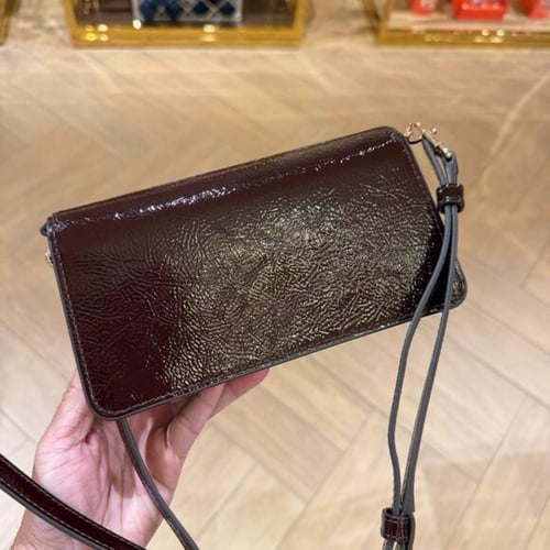 حقيبة توري بورش ايمرسون كروس بدي عنابي تصل خلال اس...