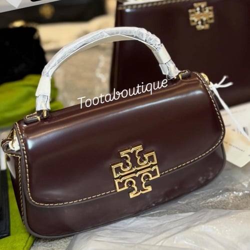 حقيبة توري بورش ميني برتن توب هاندل عنابي فوري