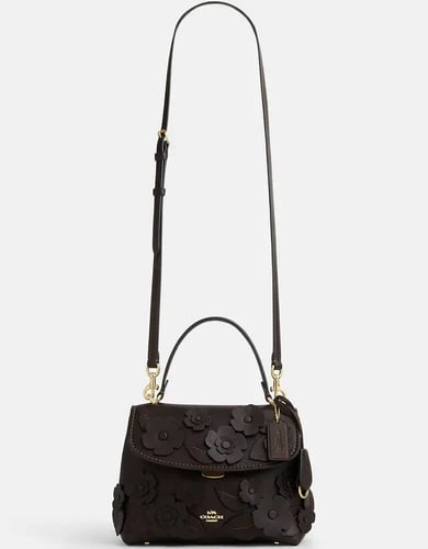 حقيبة كوتش ايموري بمقبض علوي مع زهور مطبقة تصل خلا...