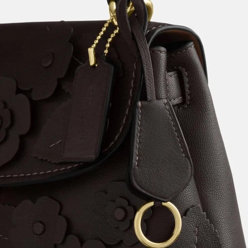 حقيبة كوتش ايموري بمقبض علوي مع زهور مطبقة تصل خلا...