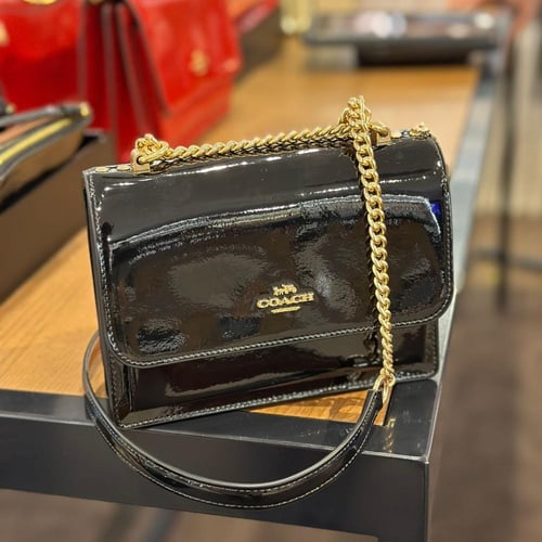 حقيبة كوتش ميني كلير لماع اسود فوري