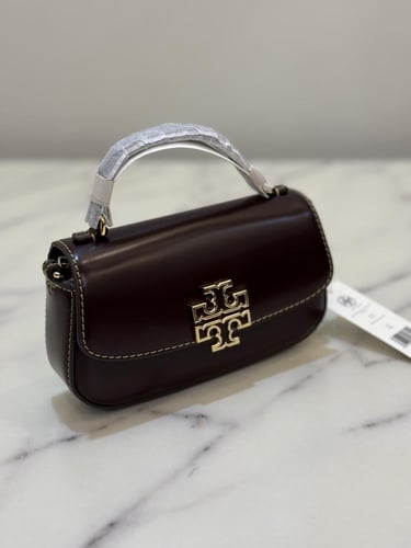 حقيبة توري بورش ميني برتن توب هاندل عنابي فوري