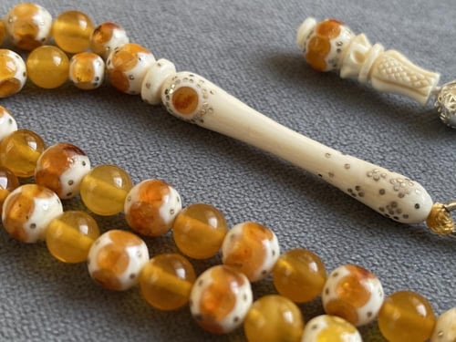 سبحة عاج فيل مطعّمة كهرمان و فضة