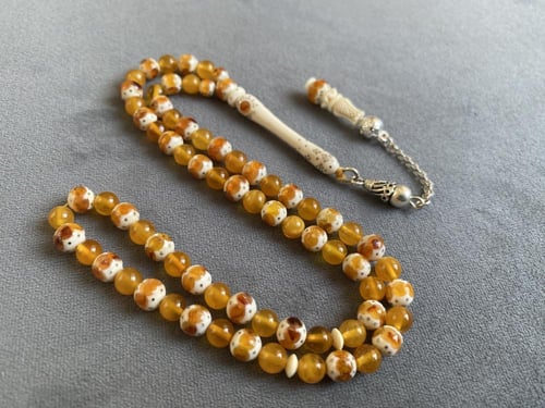 سبحة عاج فيل مطعّمة كهرمان و فضة