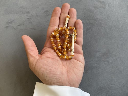 سبحة عاج فيل مطعّمة كهرمان و فضة