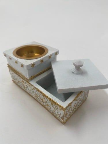 مبخرة مع علبة