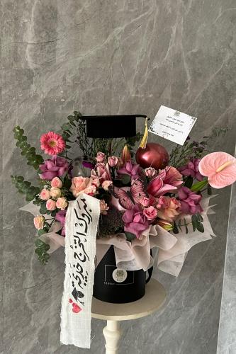 باقة التخرج مع قبوع التخرج