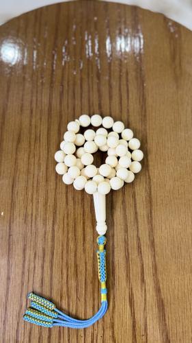 Biscuit prayer bead with ivory fingerprint, with s...