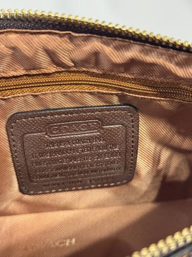 شنطة كوتش بني