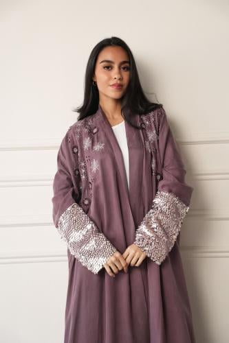 A silk abaya with distinctive embroidery on the chest and sleeves