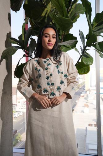 Beige thobe with a distinctive cut and hand embroidery