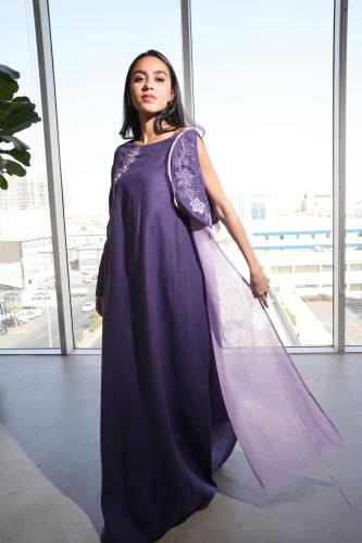 A dress in burgundy color with a stunning shawl design