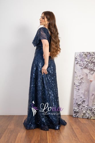 فستان سهرة أزرق كحلي بتطريز براق وأكمام شفافة قصير...