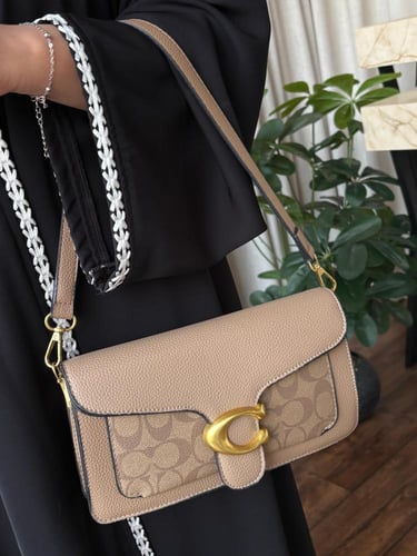 شنطة كوتش جلد ولمعه