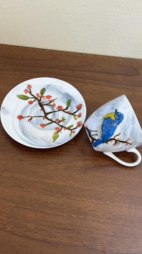 كوب صغير برسمة عصفور