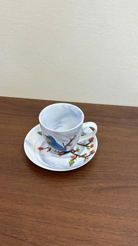 كوب صغير برسمة عصفور