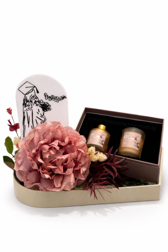Graduation gift candle with artificial flowers