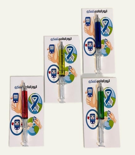 توزيعات اليوم العالمي للسكري ..قلم حبر بشكل إبرة