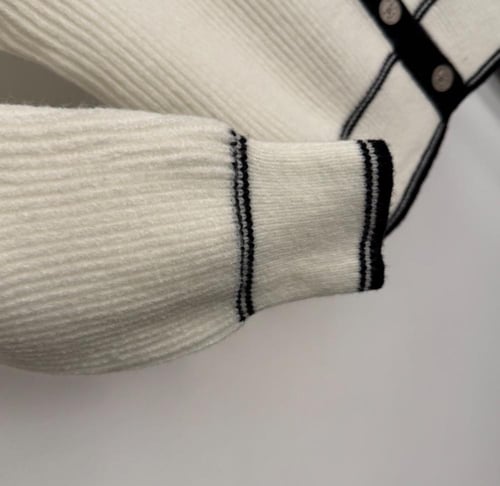 White and black sweater
