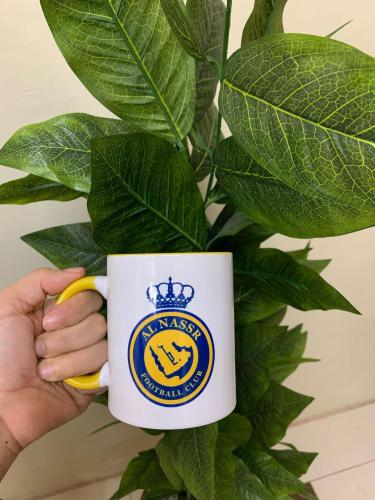 كوب نادي النصر السعودي الأبيض بشعار النصر