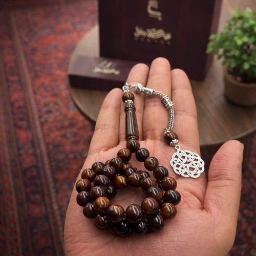A beaded rosary with a metal tassel.