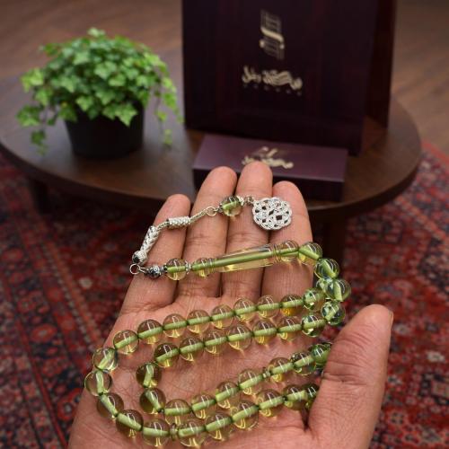 A beaded rosary with a metal tassel.