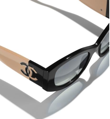 نظارة شمسية شانيل بإطار بيضاوي أسود بيج