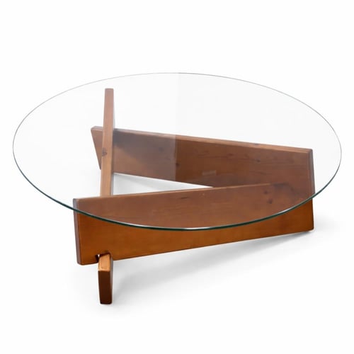 طاولة قهوة دائرية بزجاج شفاف وقاعدة خشبية متقاطعة