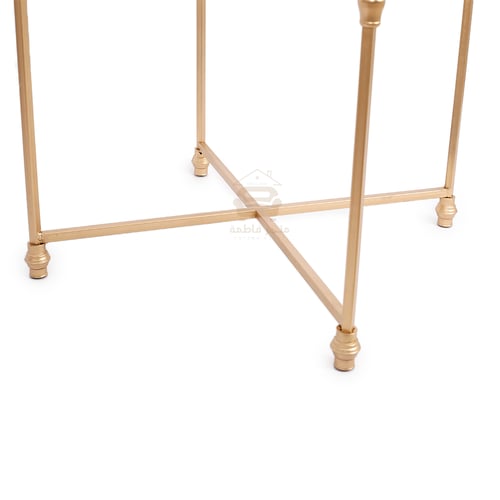 طاولة جانبية لون ذهبي قواعد حديد سطح زجاج شفاف