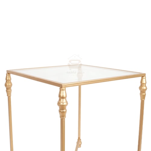 طاولة جانبية لون ذهبي قواعد حديد سطح زجاج شفاف