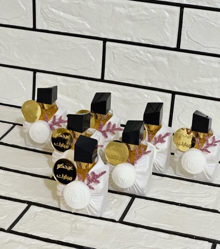 عطور توزيعات سان لوران 12 حبه مع تغليف الاسم حسب ا...