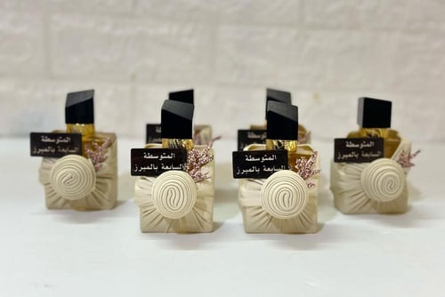 عطور توزيعات سان لوران 12 حبه مع تغليف الاسم حسب ا...