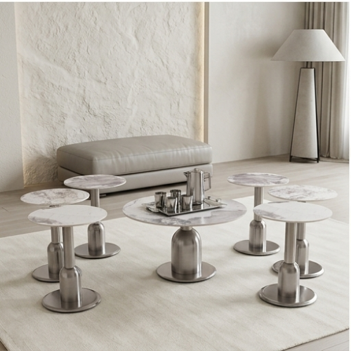 طقم طاولات ضيافة دائرية بسطح سيراميك وقاعدة فضية 7...