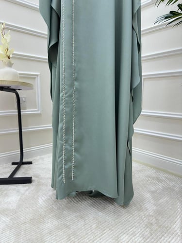 جلابية باللون التيفاني مع تطريز