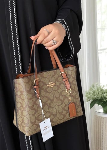 شنطة كوتش مولي توت باق