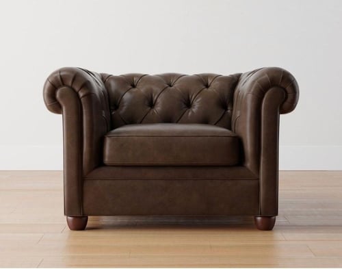 كرسي بذراعين جلد