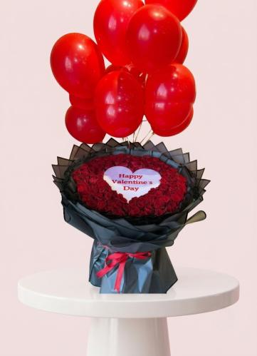 A large bouquet of flowers and a chain brand FG si...
