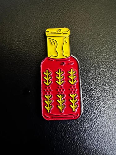 ملصق معدني قارورة