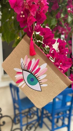 شنطة كلتش عين