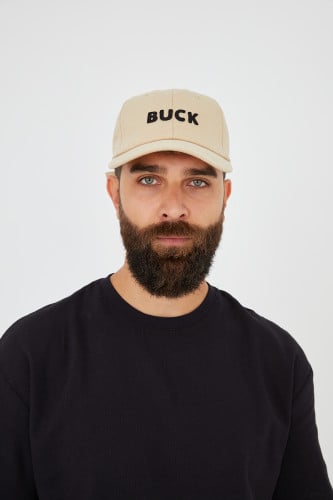 كاب بيج بكتابة BUCK على شكل خياطه